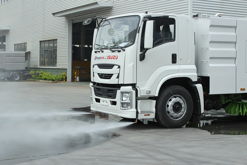 Front flushing for road cleaning and dust suppression Front flushing for road cleaning and dust suppression