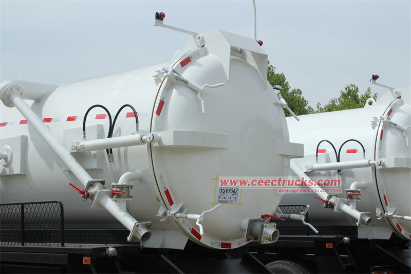 Sludge suction truck rear door and discharge valves