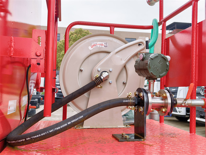 Water hauling truck with hose reel